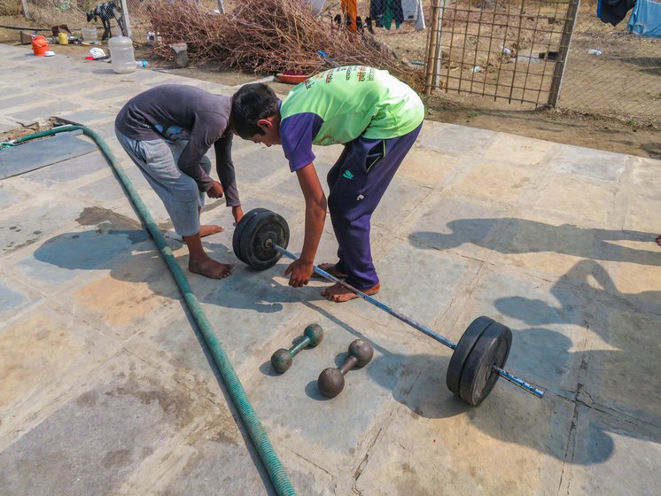 Left: Boys showing the only strength training equipments that are available to them at the academy.