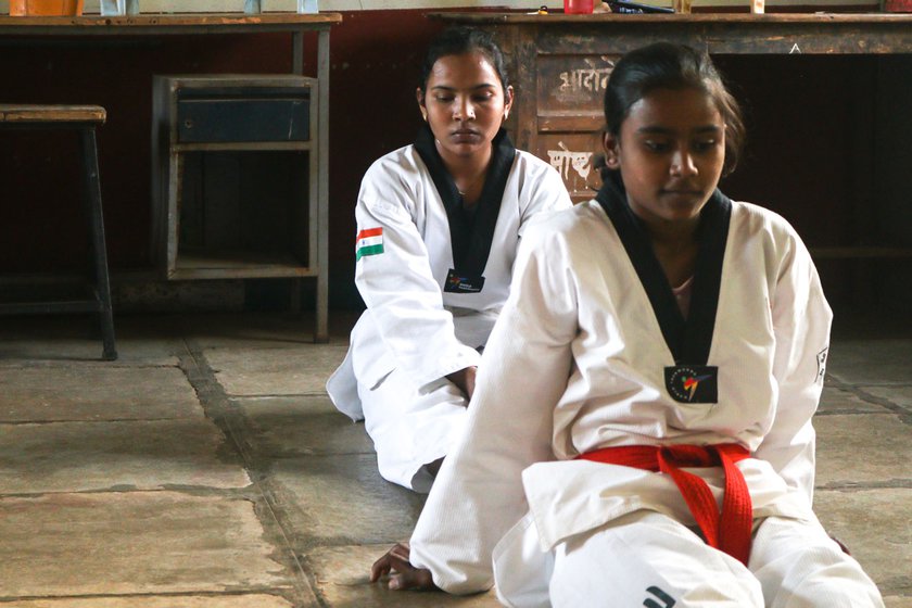 Sprinter and Taekwondo champion Aishwarya Birajdar (seated behind in the first photo) started experiencing heightened anxiety after the floods of 2021. She often skips her training sessions to help her family with chores on the farm and frequently makes do with one meal a day as the family struggles to make ends meet