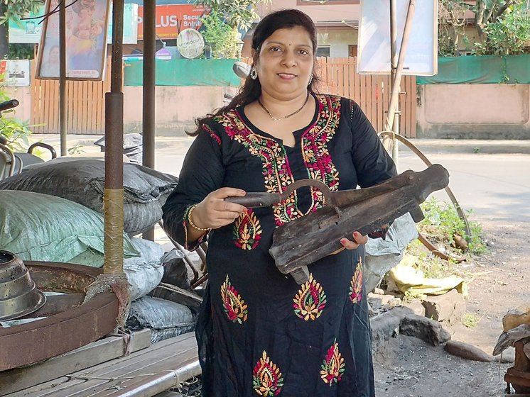 Sonali Chaphekar, Rajesh's wife holds a traditional morli used to cut vegetables and fruits (left).
