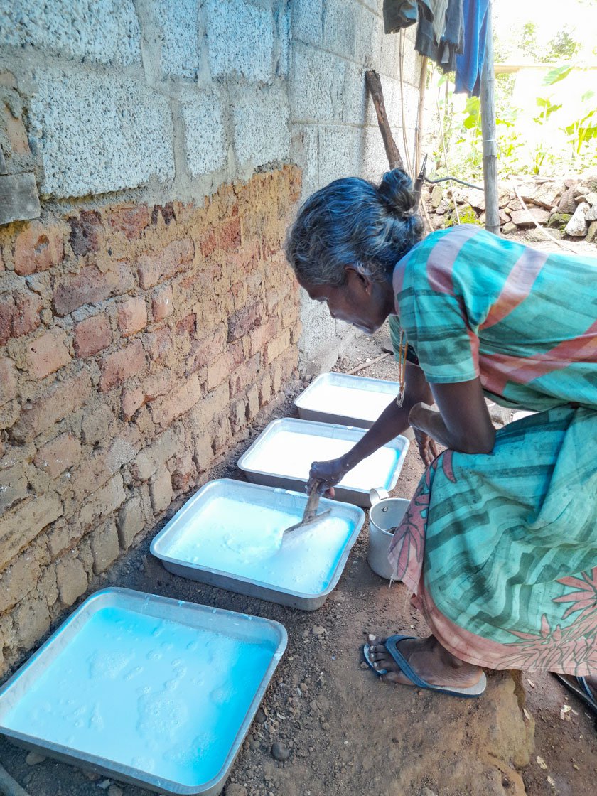 Srirangan pours the latex into the vessel using a filter (left); Leela mixes some acid in it (right) so that it coagulates