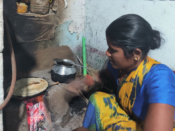 Rajeshwari making jonne roti in their home in Yenkepalle village