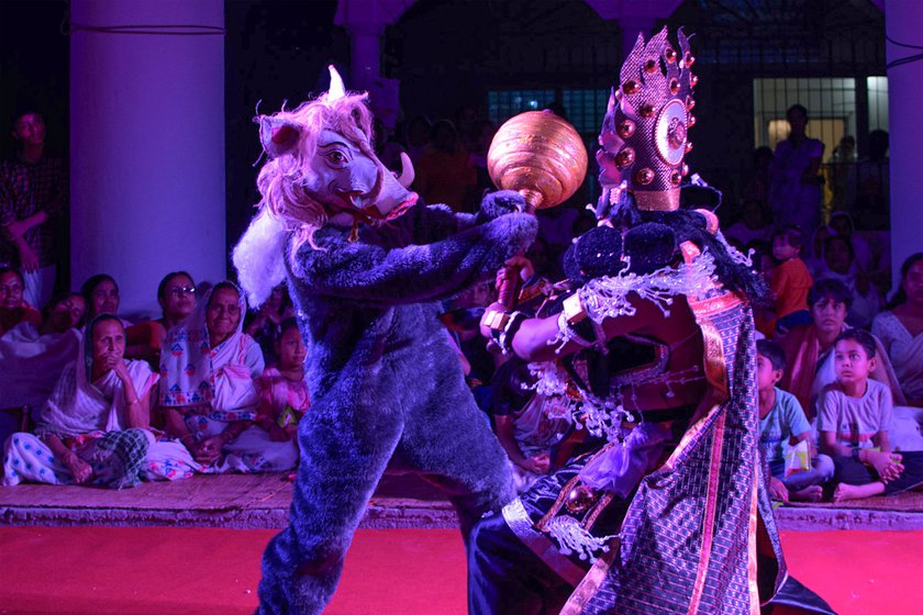Right: In the role of Boraho (left), he fights the asura (demon) Hiranyaksha in a drama titled Nri Simha Jatra