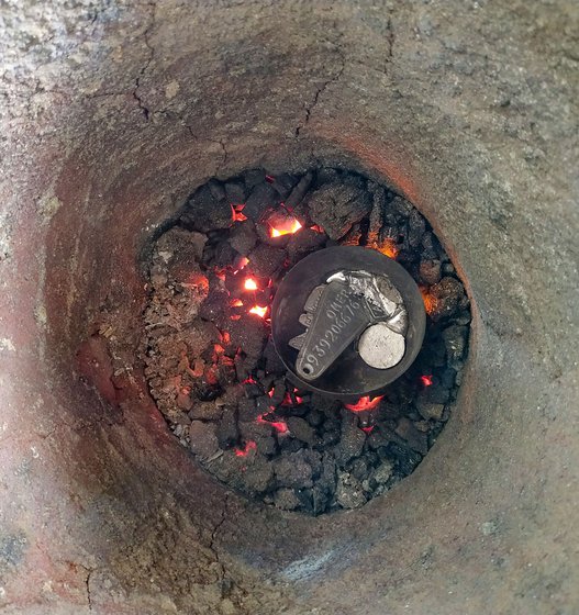 Left: After he has put sanjeera powder over the cavities before pouring in the molten metal. Centre: Operating the hand blower. Right: The metal pieces kept inside the bhatti for melting