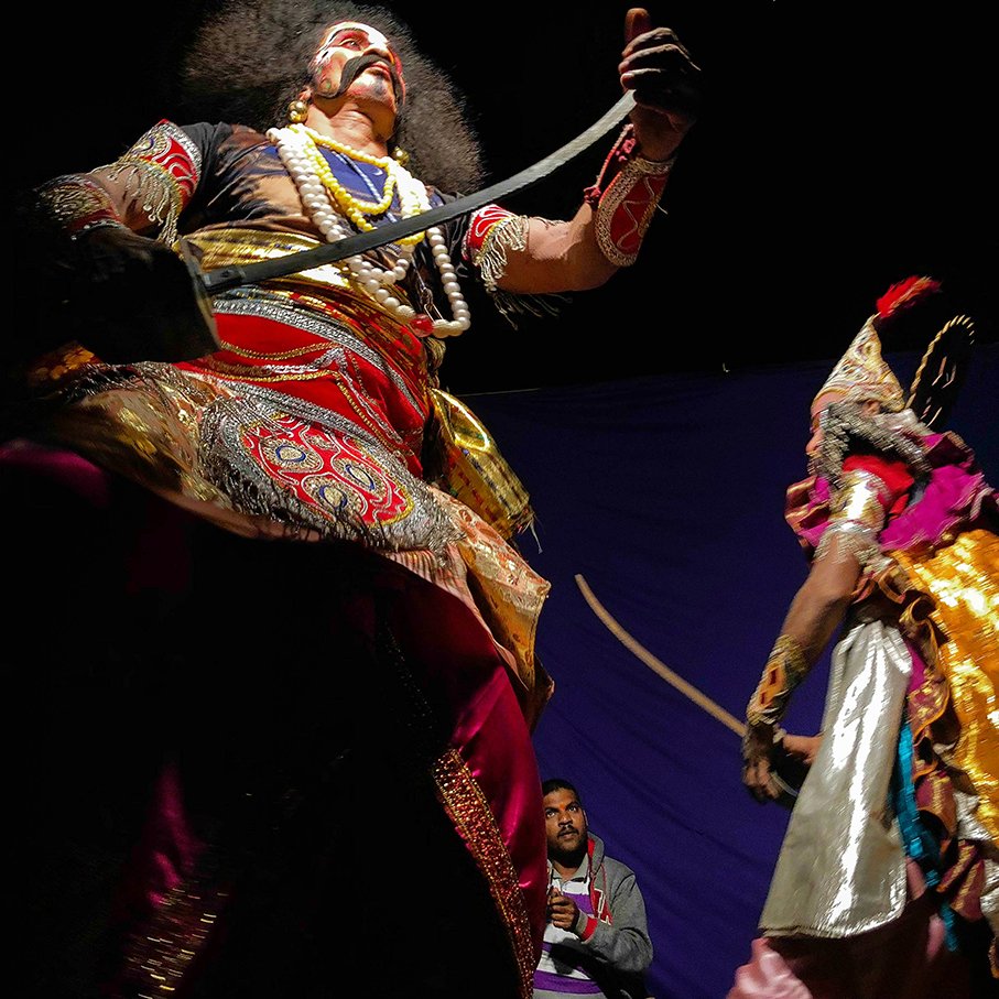 Actors playing warriors rehearse their fight scene before the performance in Harmal (Arambol) village