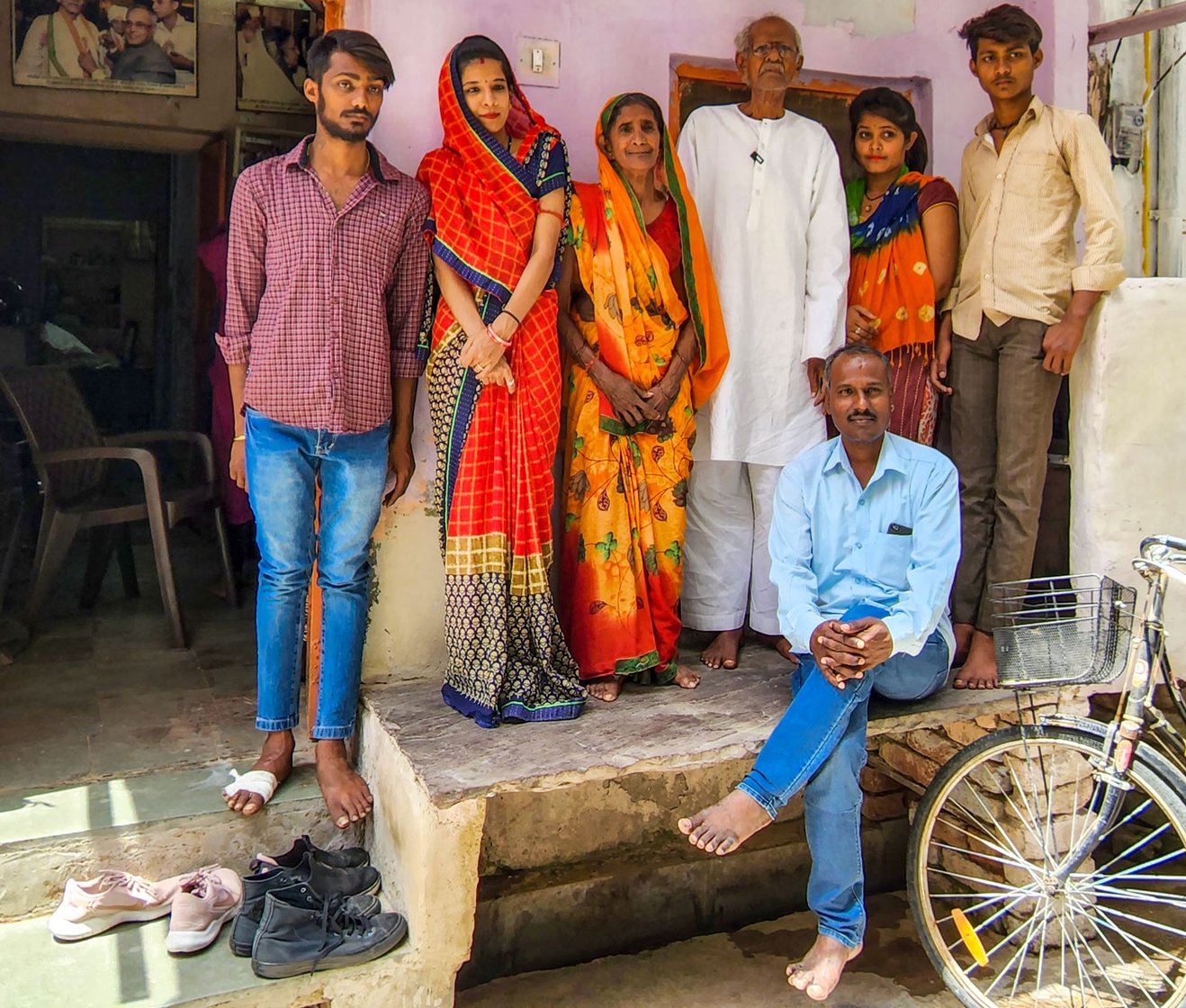 Shobharam with his family outside their home in Ajmer. In his nineties, the over six feet tall gentleman still stands ramrod straight