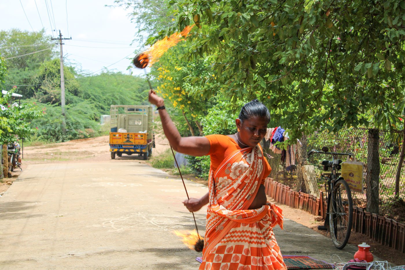 Rukmini, from the Dommara settlement in Manamadurai, draws the crowds with her fire stunts, baton twirling, spinning and more
