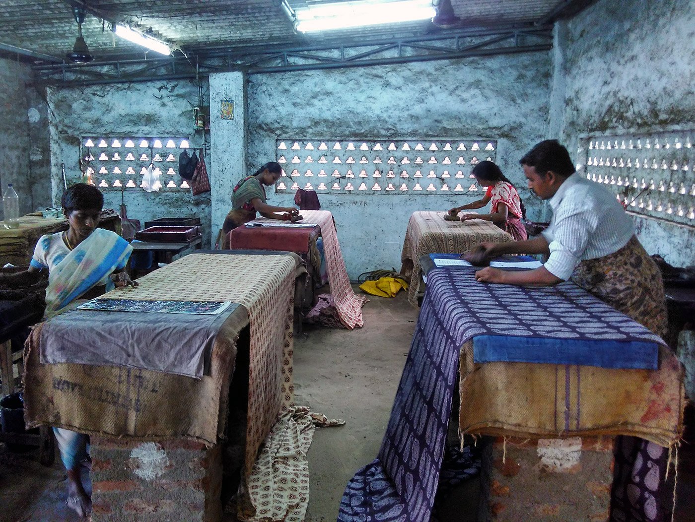 Kalamkari artisans creating block prints in a workshop in Pedana