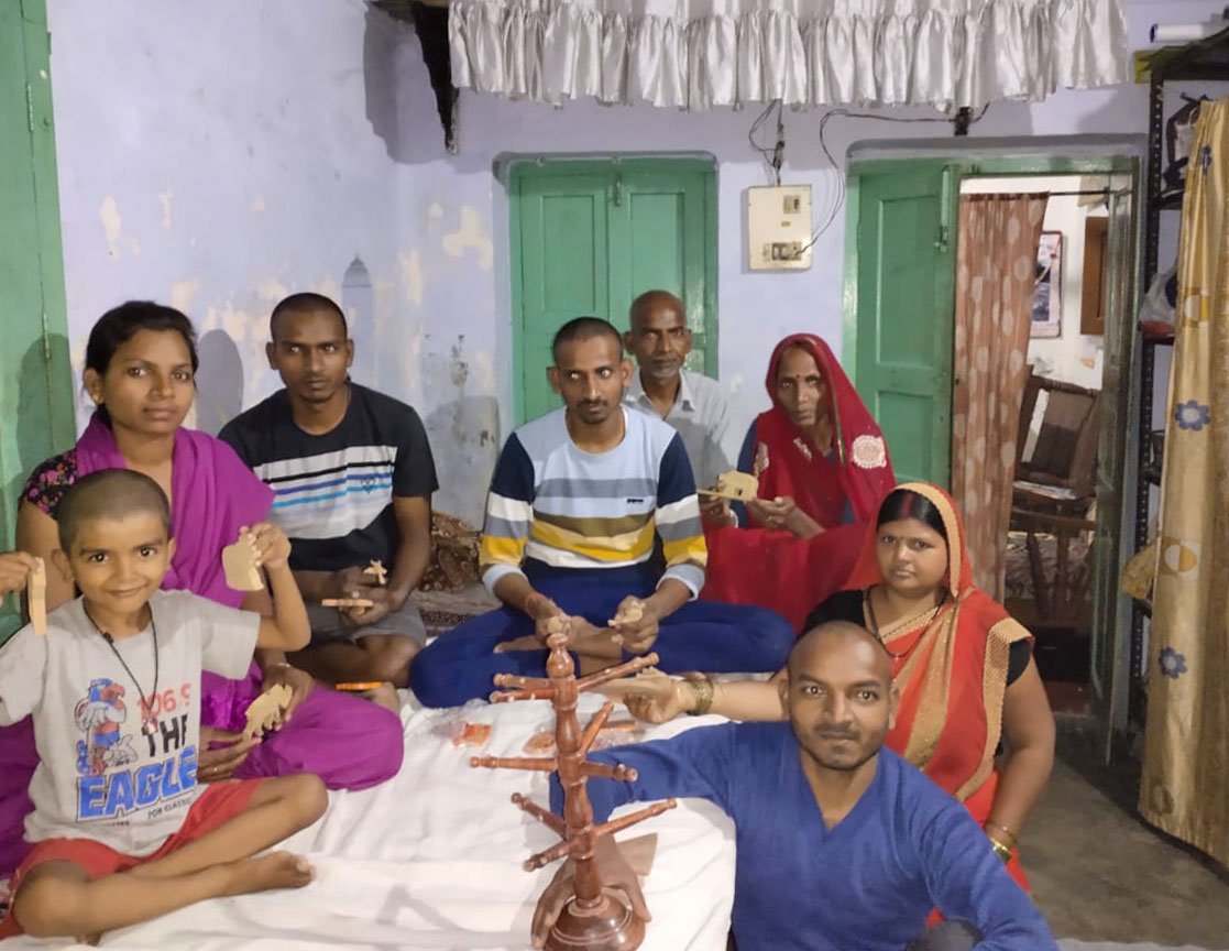 Ajit Kumar Vishwakarma, a wooden toy-maker in Varanasi, Uttar Pradesh, with his family: '“Now I am thinking of where to get food'