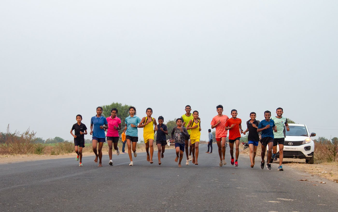 Athletes practicing on the Beed bypass road. 'This road is not that busy but while running we still have to be careful of vehicles passing by,' says coach Ravi
