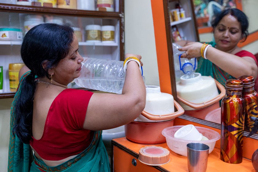 Pramila brings around 10 litres of water with her from home as there is no running water in the shopping complex where the parlour is located.