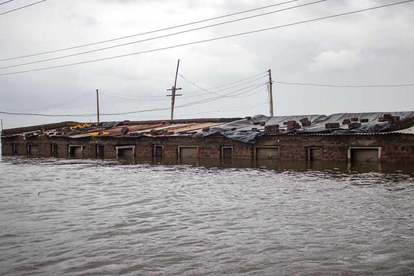 On the outskirts of Kolhapur’s Shirati village, houses (left) and an office of the state electricity board (right) were partially submerged by the flood waters in August 2019