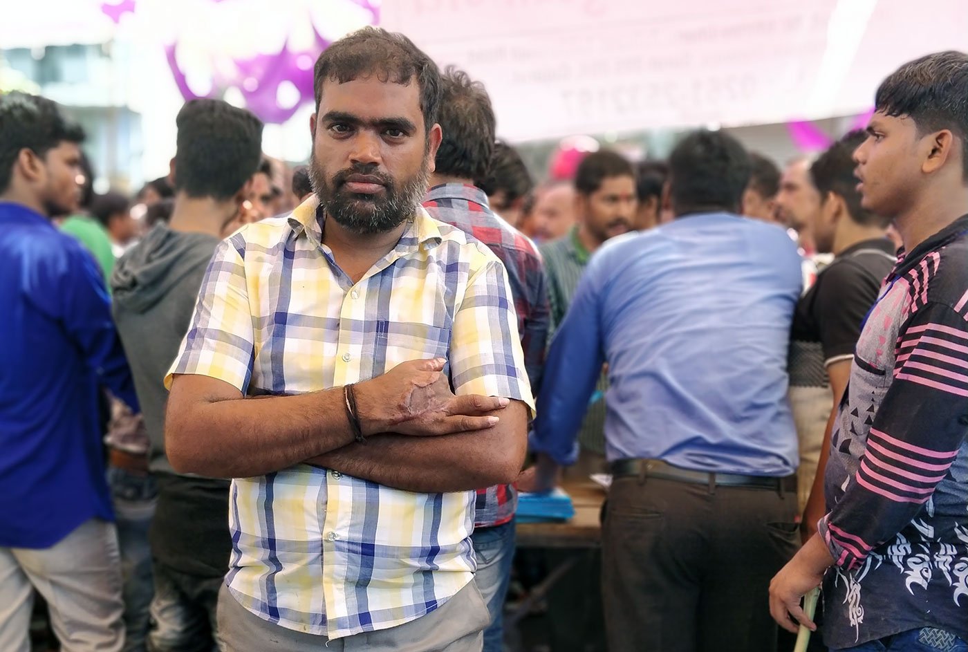 Rushikesh Rout, 38, a former powerloom unit worker lost three fingers in a freak accident in June last year. He now works as a security guard, carrying with him little hope to be compensated for his lost fingers.