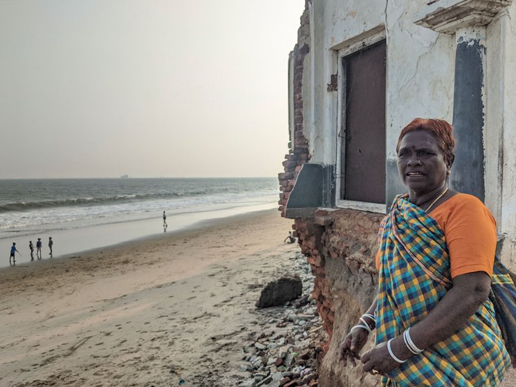 M. Poleshwari outside her third house; the first two were lost to the sea. “We take debts again and the house gets submerged again”