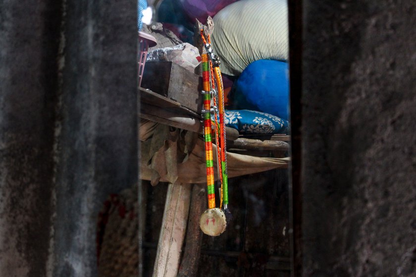 Left: A sarangi hanging inside Kishan's house. He considers this his father's legacy.