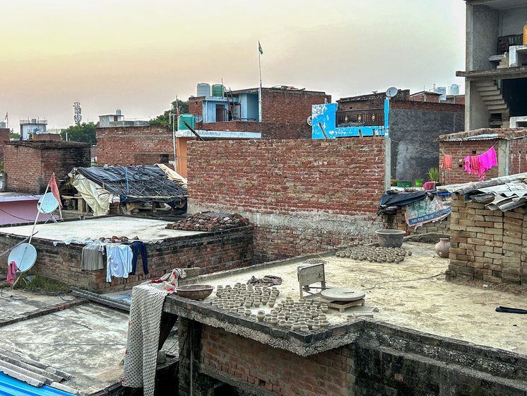 Left: The view from Deshraj’s terrace showing the clay artefacts drying on terraces of other houses in the mohalla .