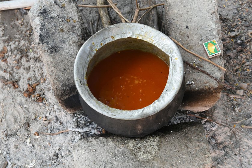 Irula Adivasis relish rat meat, which they cook fresh after catching the rodents. Right: A tomato broth getting ready for the meat to be added

