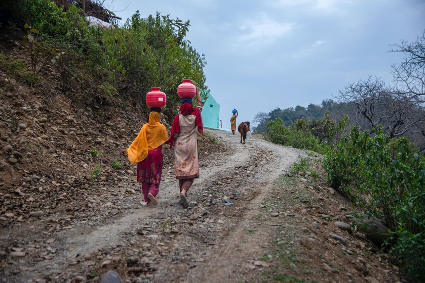 Left : Women from the community carry water for three to four kilometres as most hamlets don't have drinking water.