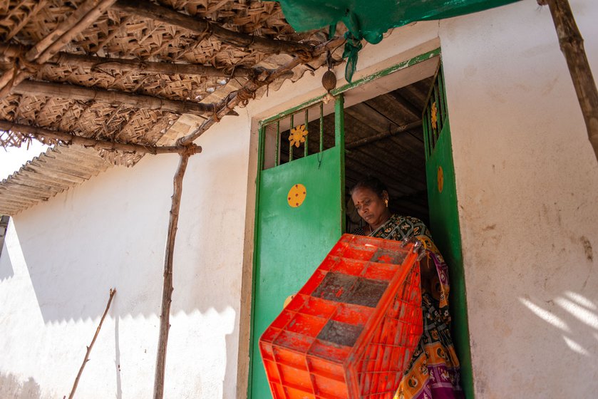 Visalatchi brings a box  (left) from her shed to collect the dried fish. Resting with two hired labourers (right) after lunch. After the Tamil Nadu government enforced a ban on ring seine fishing in 2020, her earnings declined steeply and she had to let go her workers