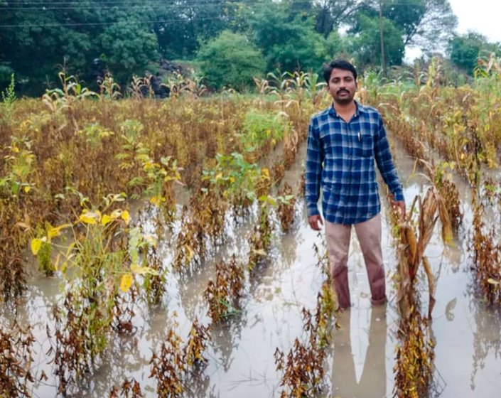 Left: Gopal Shinde with his daughters. Right: Gopal's friend standing in his water-filled farm last October