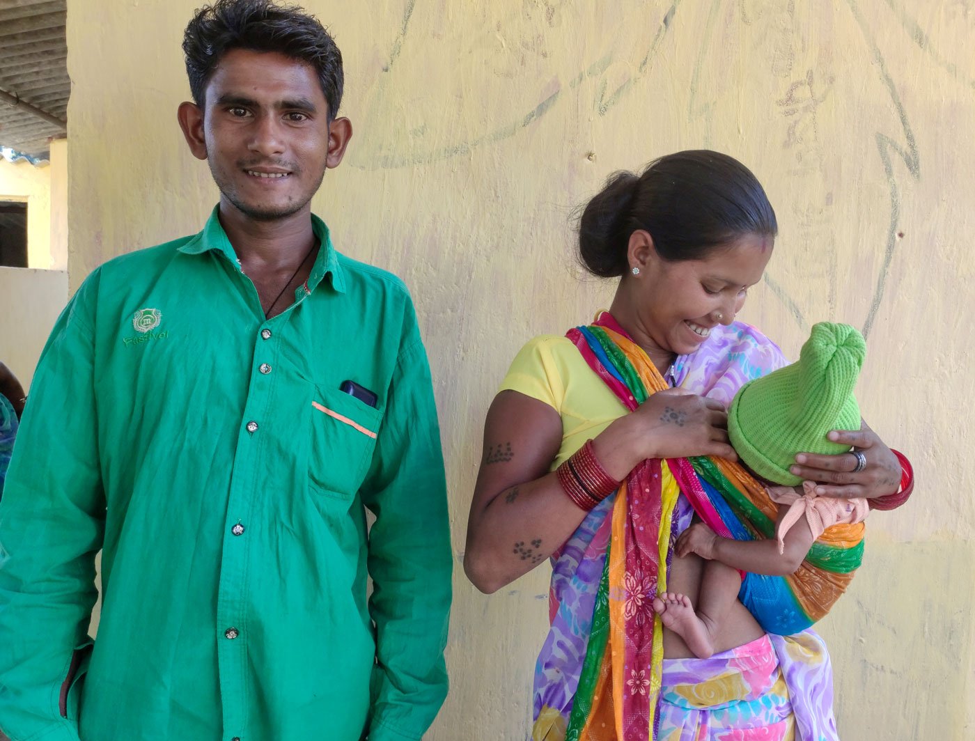 Left: Dr. Meenal Indurkar, district consultant for health in Narayanpur, speaking to young mothers about malnutrition. Right: Dashmati Yadav (with her husband Prakash and their baby girl), says, '...my baby boy died after birth at home. So this time my husband called the ambulance and I was taken to Benoor for my delivery'