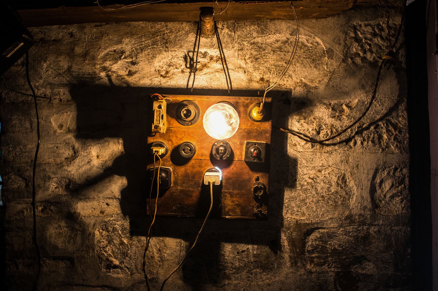 A traditional wooden switchboard that serves as a reminder of Bapu's carpentry days