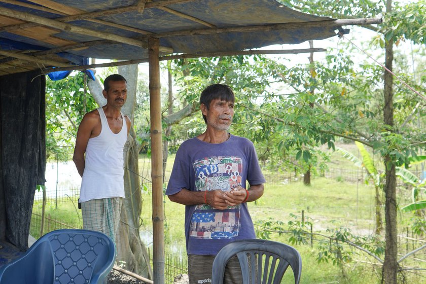 Right: 'When the water rose, we came up to the embankment. I don't want to take a risk this time,’ says Dandeswar (purple t-shirt), who works as farmer and a mason in between the cropping seasons. Standing behind him is Dwijen Das