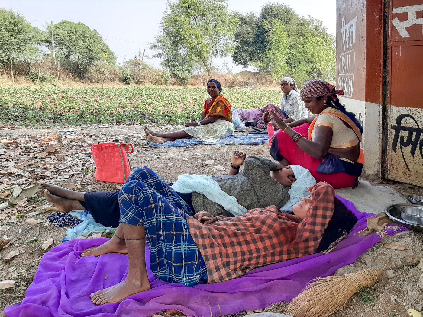 A group of women agricultural labourers resting after working in a paddy field in Raka, a village in Rajnandgaon district of Chhattisgarh