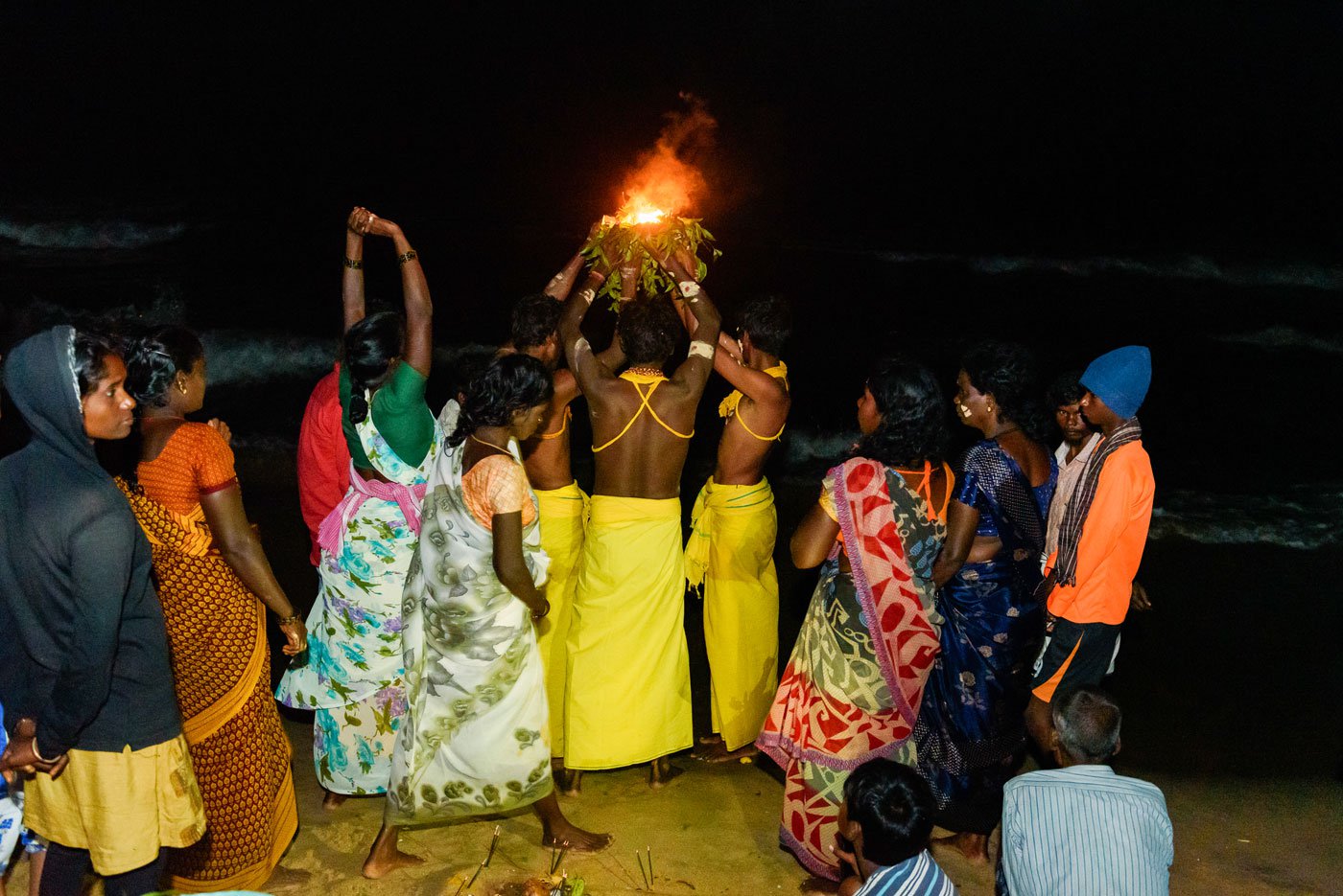 Prayers begin several hours before sunrise. Many of the devotees are dressed traditionally in yellow or orange clothes