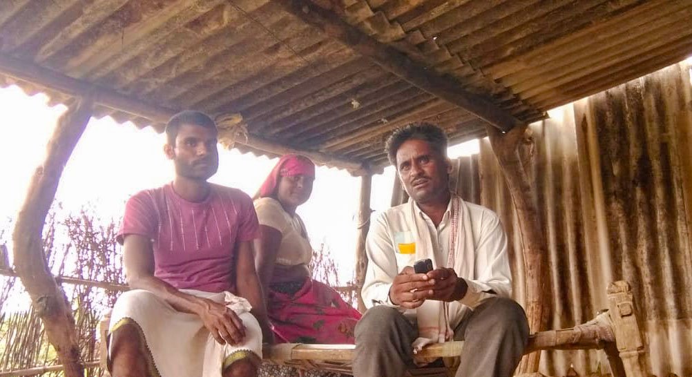 Rajesh Damor (seated on the right) with his neighbours in Sukhwara panchayat. He speaks Bhili, Wagdi, Mewari, Gujarati and Hindi, the last helped him negotiate with the contractor when their dues of over Rs. two lakh were held back in Morbi in Gujarat