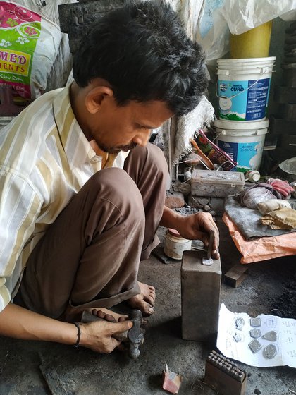 Left: Punching the letters on the token. Centre: One set of an order of 1,000 tokens that was not picked by a customer. Right: Azeem shows us how a batch of the tokens will be arranged inside the peti