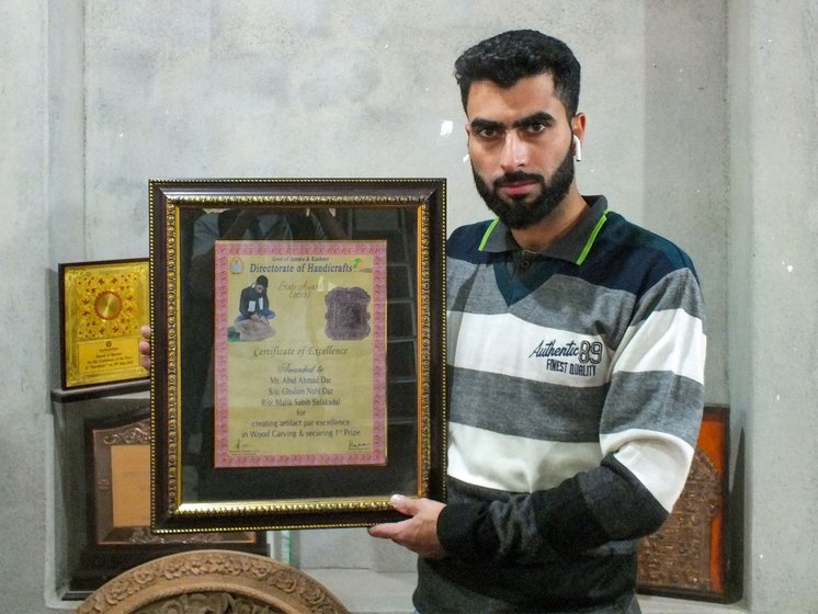 Left: Ghulam's son Abid won the State Award, given by the Directorate of Handicrafts, Jammu and Kashmir, in 2012.
