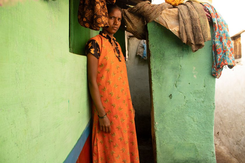 Manjula standing at the entrance of the bathing area that the women of her house also use as a toilet sometimes. Severe stomach cramps during her periods and abdominal pain afterwards have robbed her limbs of strength. Right: Inside the house, Manjula (at the back) and her relatives cook together and watch over the children