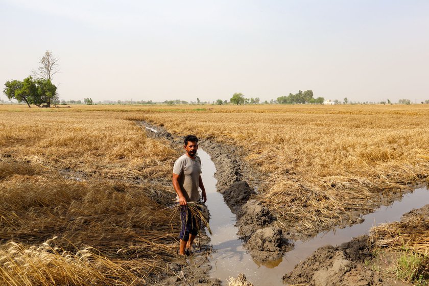 Left: Gurpal Singh, 40, of Buttar Bakhua village pumping out water from his farmland.