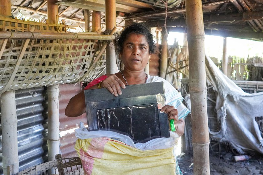 Left: 'We bought a TV twice. Both were damaged by the floods. I have put the [second damaged] TV in a sack and put it on the roof,' says Nirada.