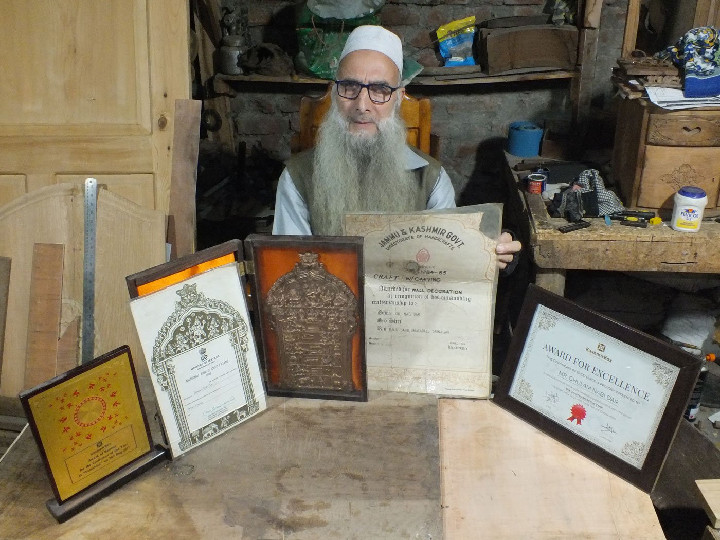 Right: Ghulam with some of his awards