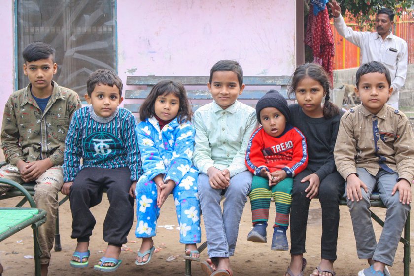 Right: Shabbir’s grandchildren with Saini’s child, Anmol. ' From our everyday living you cannot tell who belongs to which religion. We don’t discriminate between us,' says Shabbir