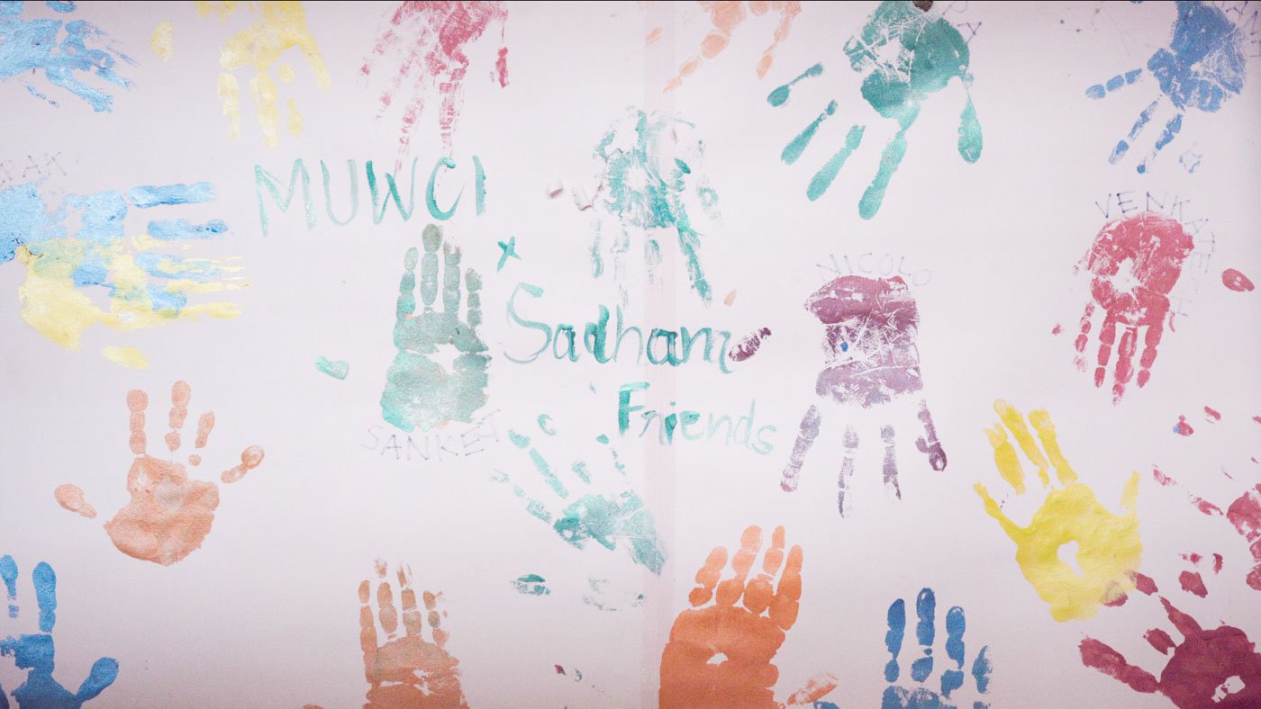 Hand prints on the wall by special friends and volunteers working at Sadhana Village
