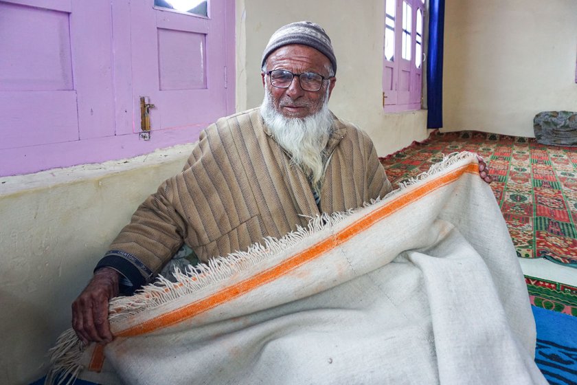 Left: Anwar Lone showing the woven blanket he made 15 years ago.