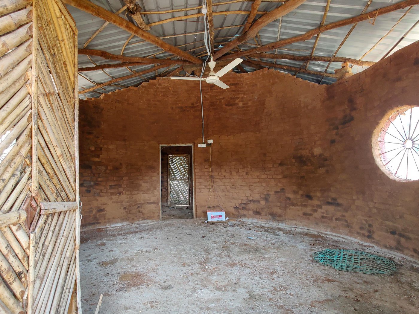 Left: Unlike community-built kurma ghars , the government huts are fitted with windows and ceiling fans.
