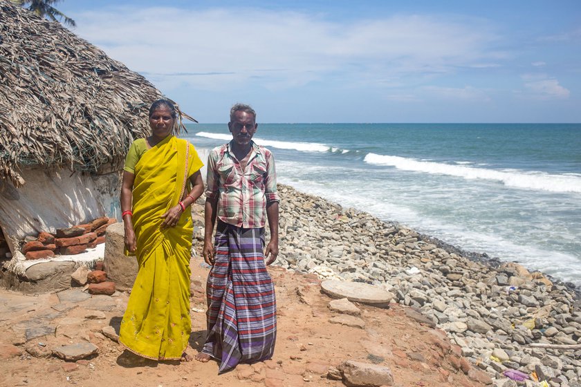 Poleru and K. Krishna outside their home, in 2019. The structure was washed away in 2021 after Cyclone Gulab struck the coast.