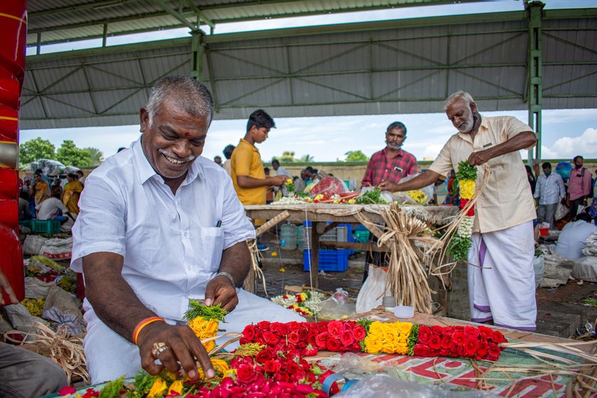 Ramachandran holds up (left) a freshly-made rose petal garland, the making of which is both intricate and expensive as he explains (right)