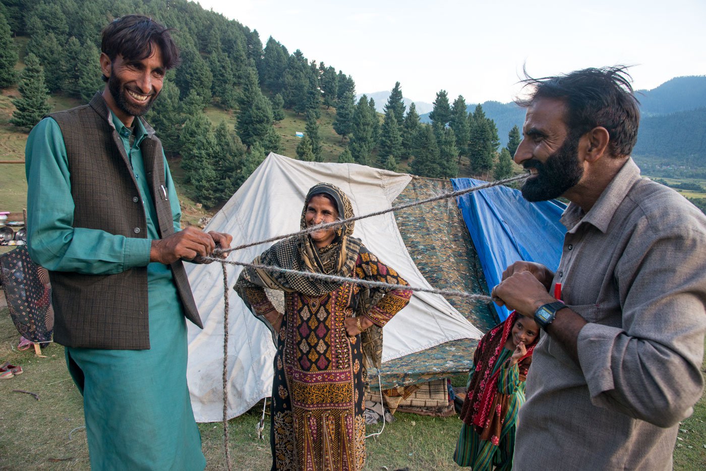 Shoukat Ali Kandal and others in his camp, making a rope from Kagani goat's hair