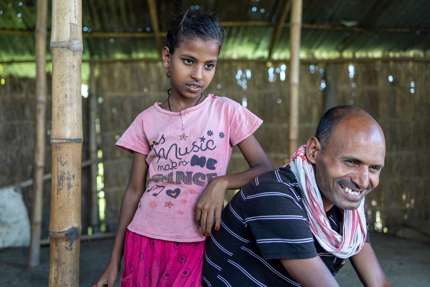 Ramvachan Yadav and his daughter, Puja, inside their house.