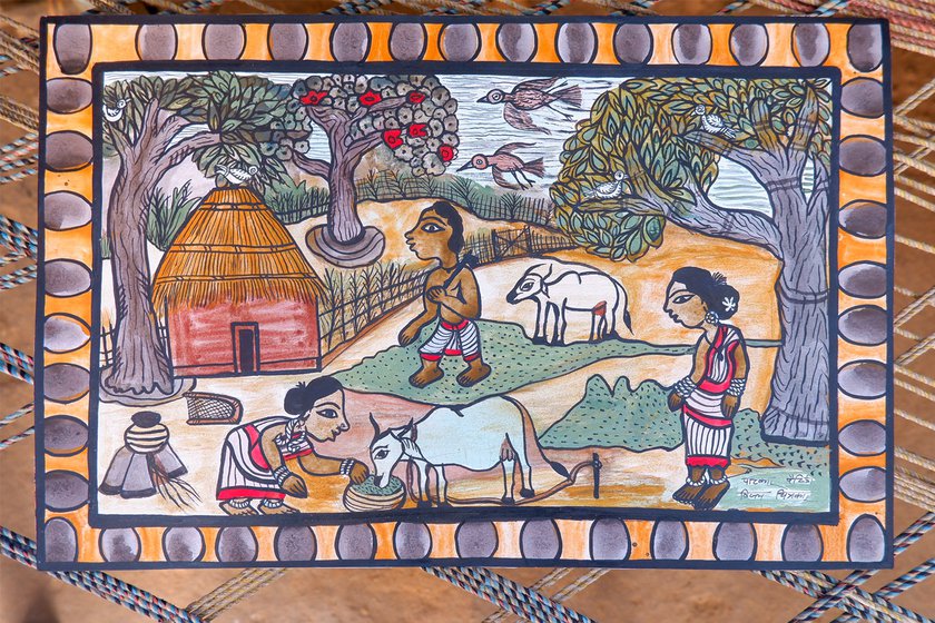 Paitkar paintings depicting Santhali lifestyle. 'Our main theme is rural culture; the things we see around us, we depict in our art,' says Vijay