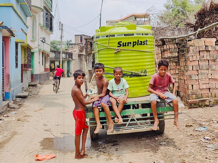Left: In Hijuli and Kazisaha, residents buy water from private dealers. Children are often seen helping the elders and also hop on to the vans for a ride around the village.