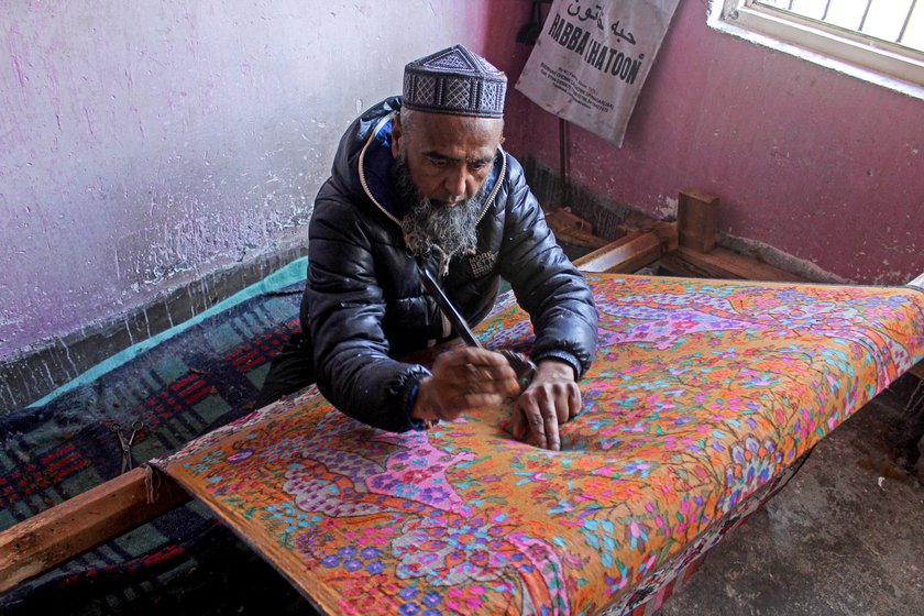 Khursheed Ahmad Bhat works on a kani shawl
