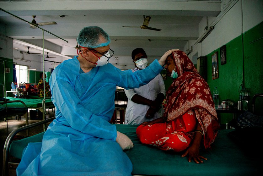 Right: Dr. Tobias Vogt checking a patient