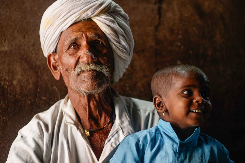 Right: Siddu spends time with his grandson in their house in Karadaga village, Belagavi.