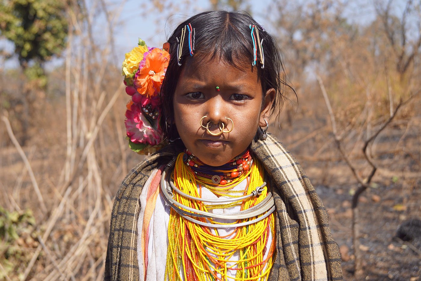 A young tribal girl wearing her traditional jewellery