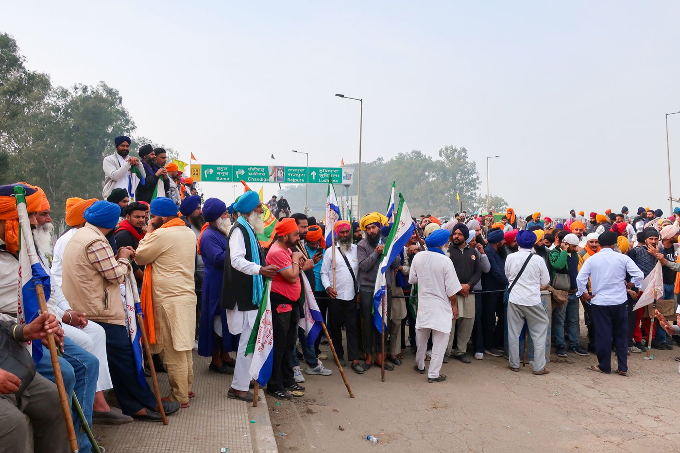 Protesters reciting satnam waheguru in front of the barricades